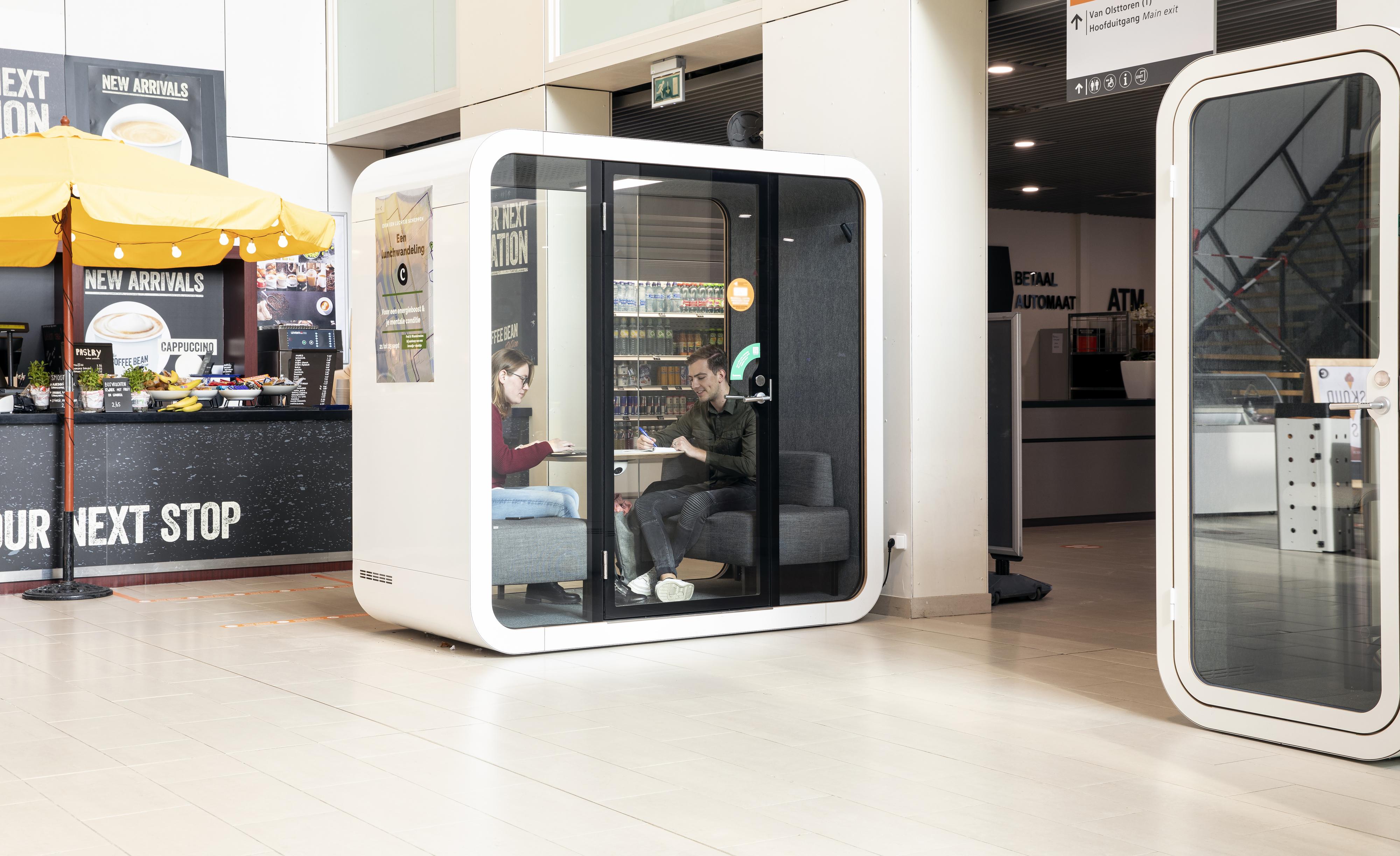 Students studying inside a Framery Q office pod