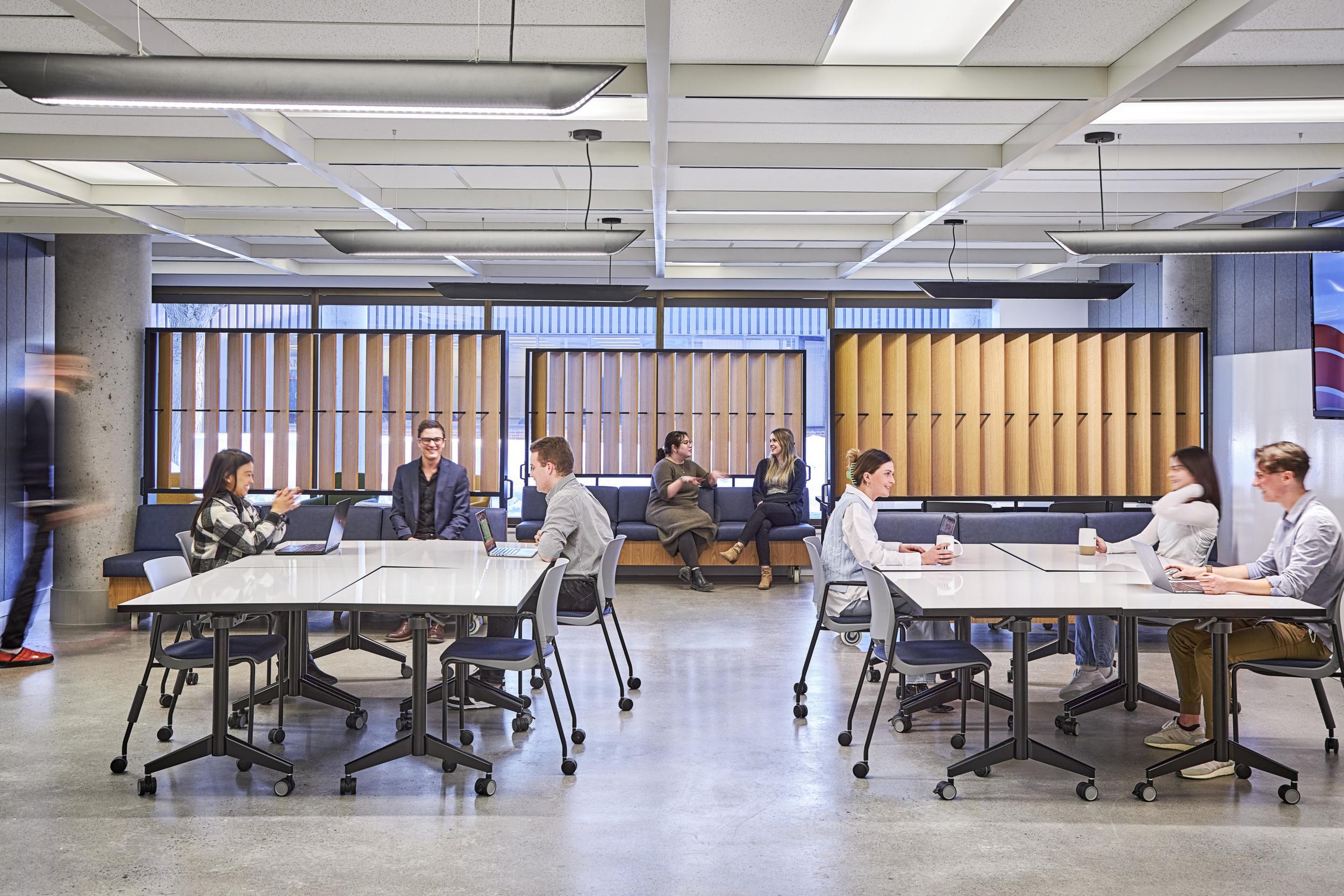 People conversing around a room in Kanata North Technology Park