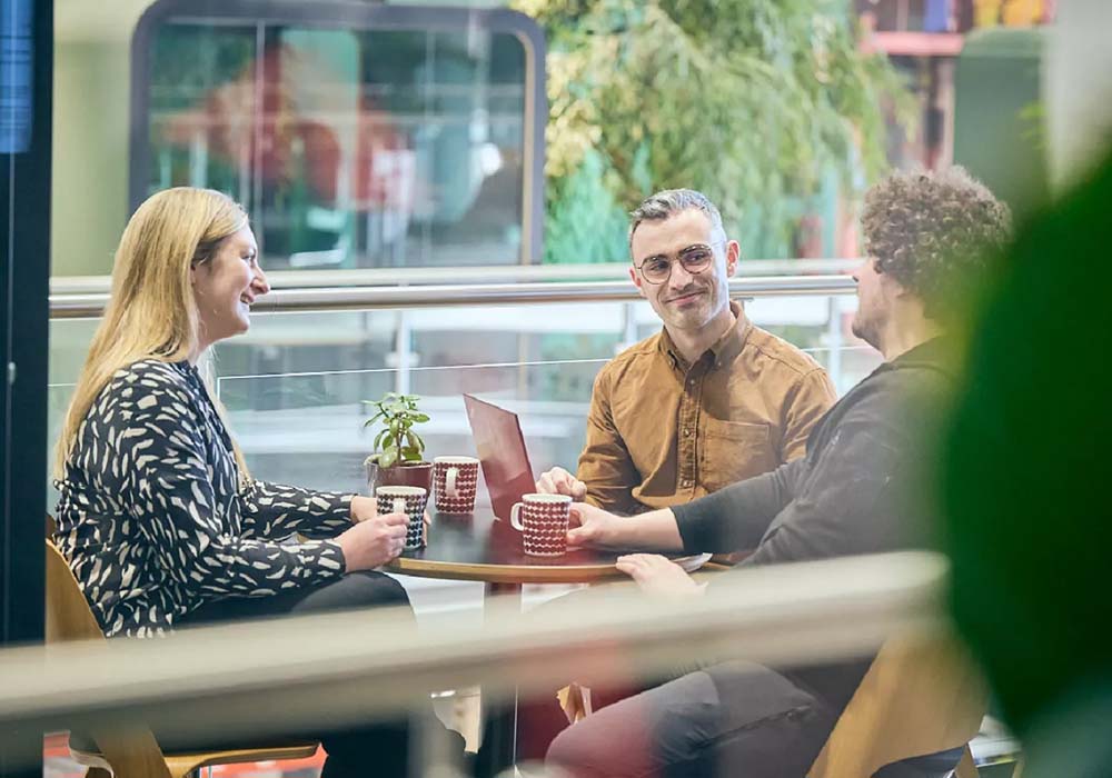 People having a coffee break at Framery factory.