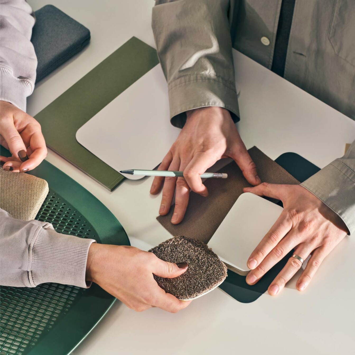 Designers choosing materials for the office pod.