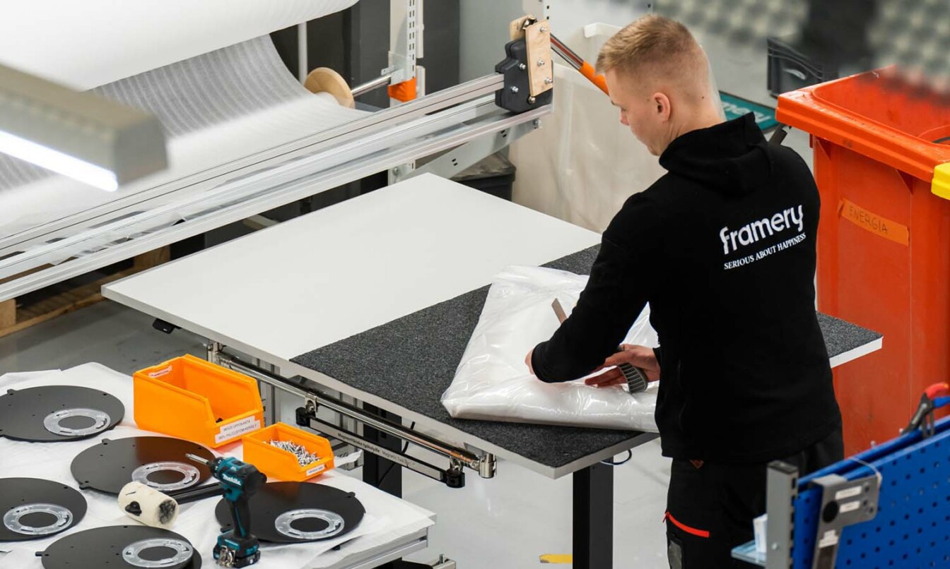 A Framery production worker manufacturing a Framery pod.