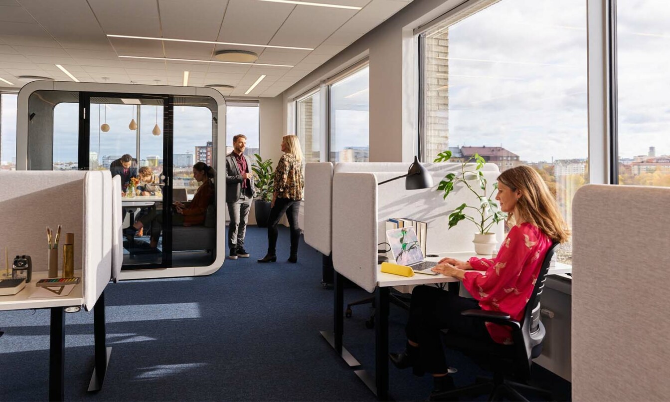 Framery office pod in an office, surrounded by soundproof cubicles.