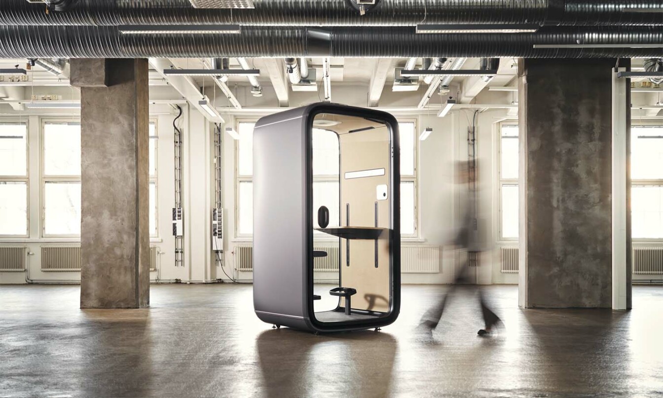 Framery One soundproof office pod in a wide open space.