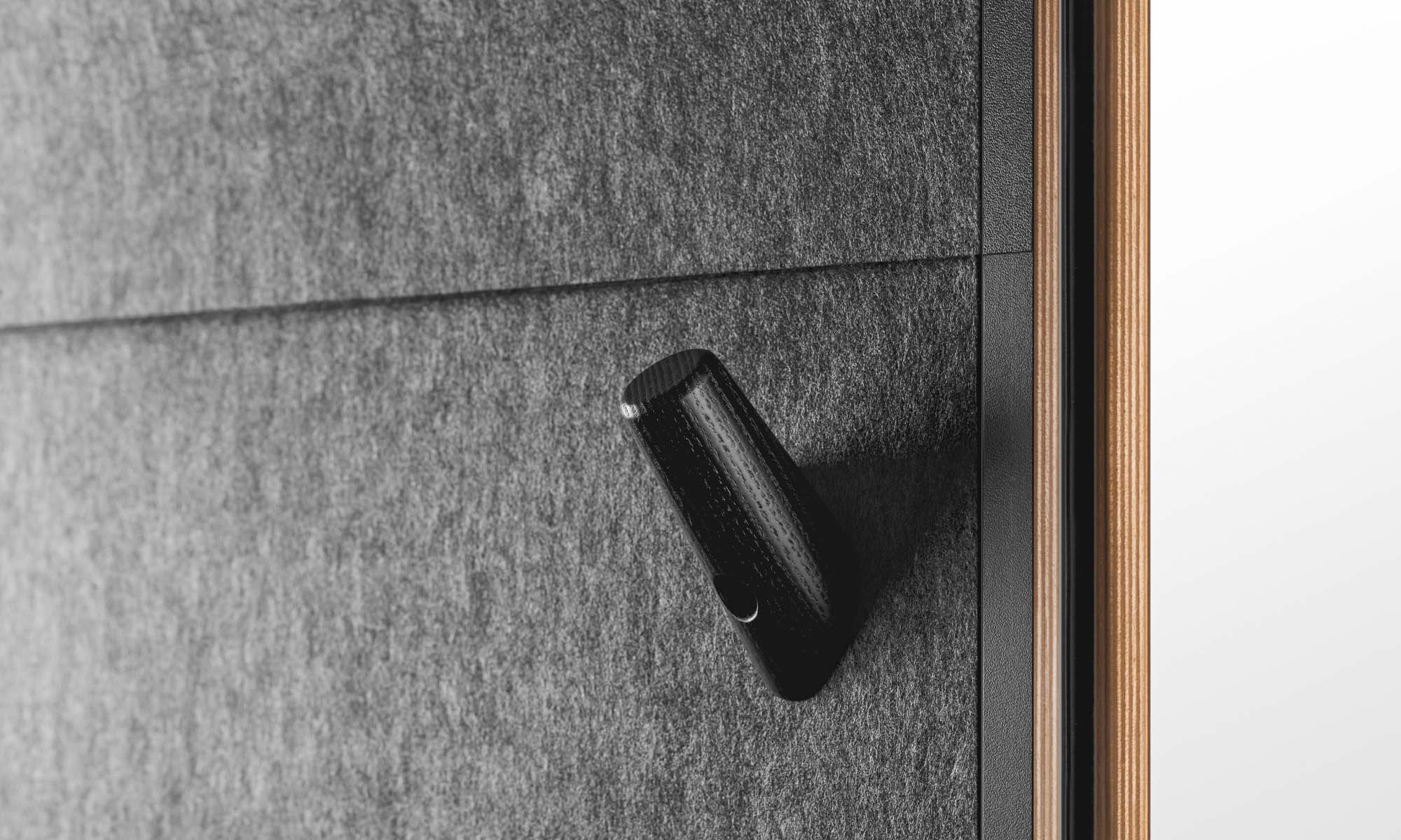 A close-up photo of Framery Q's coat hook.