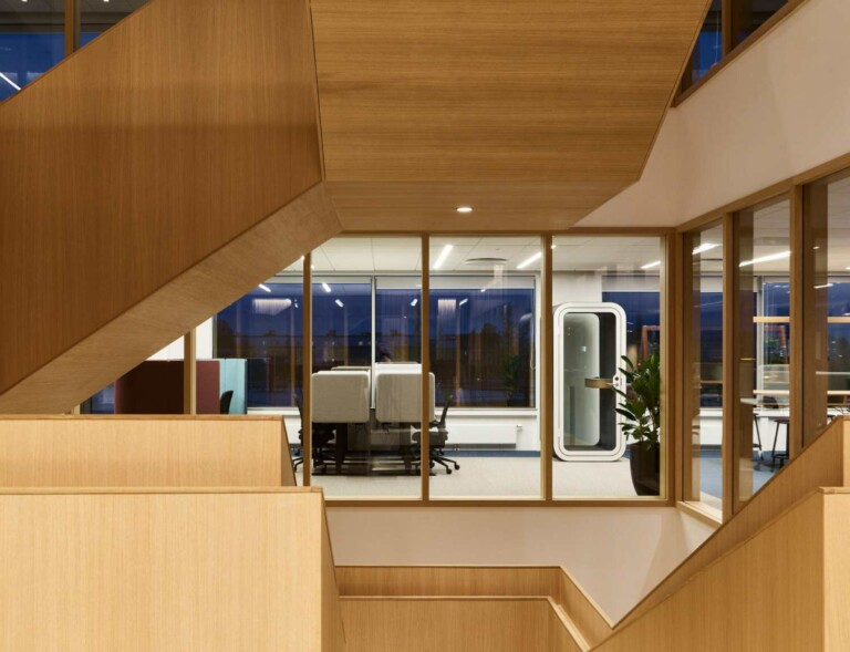 White Framery O soundproof office phone booth in open-plan co-working office