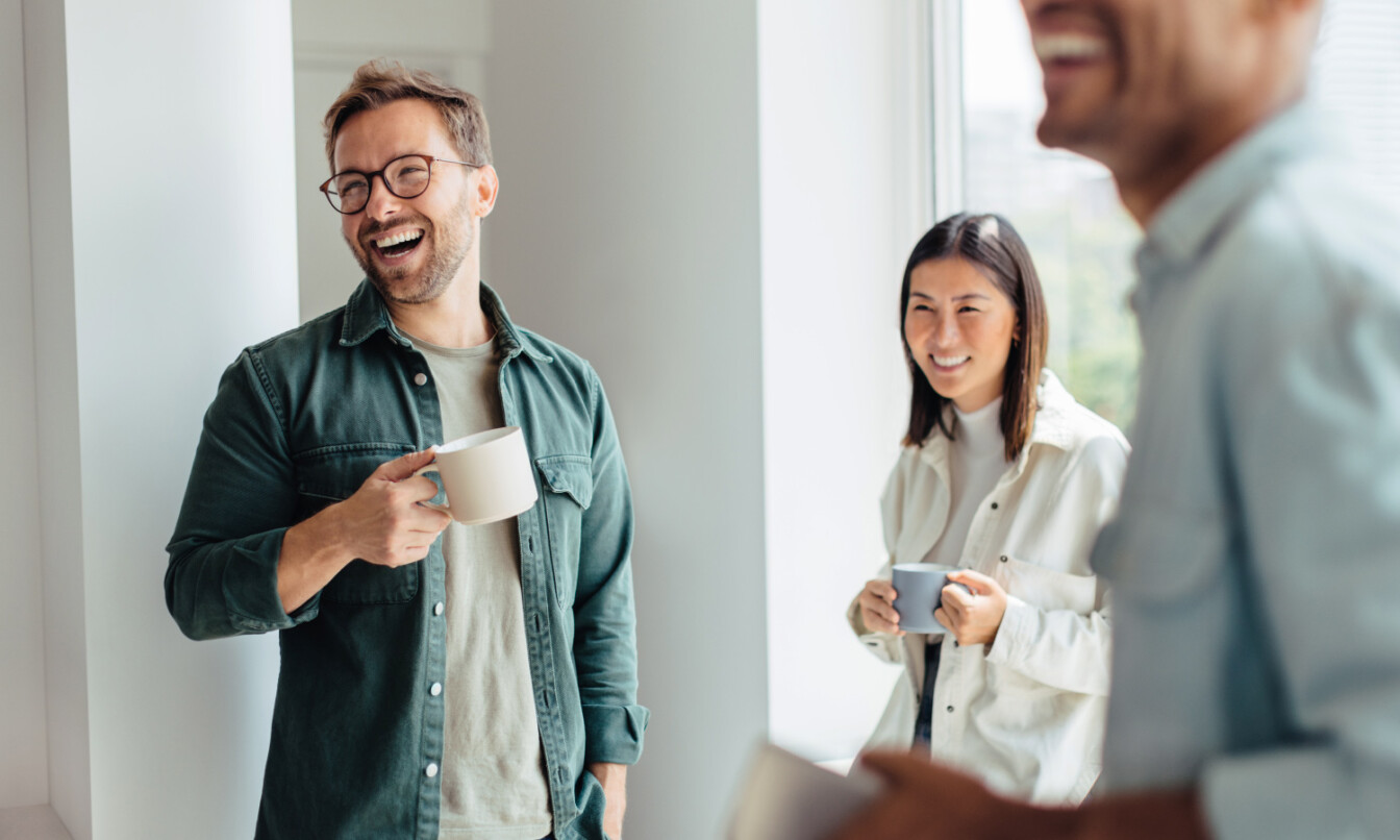 People laughing at the Framery office