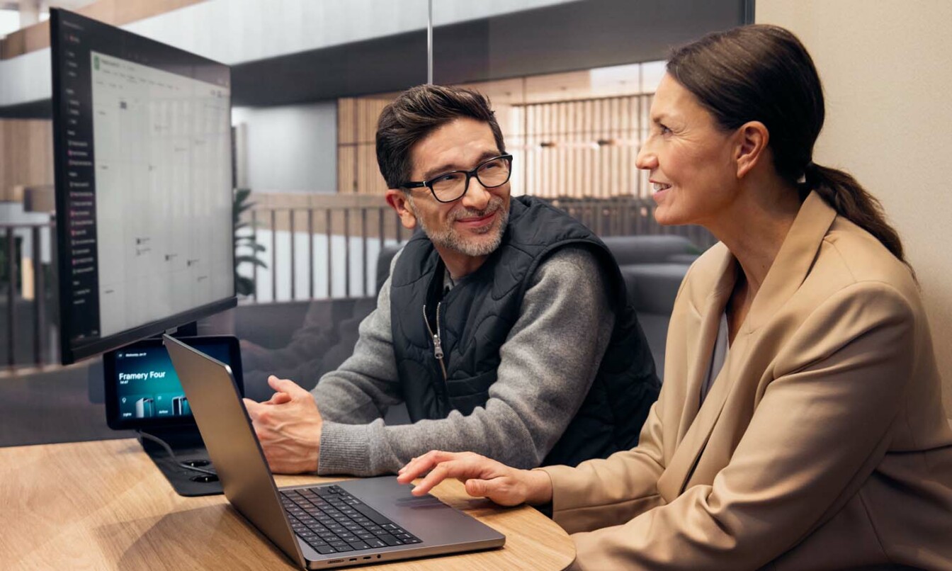 Coworkers in a meeting inside a Framery smart pod