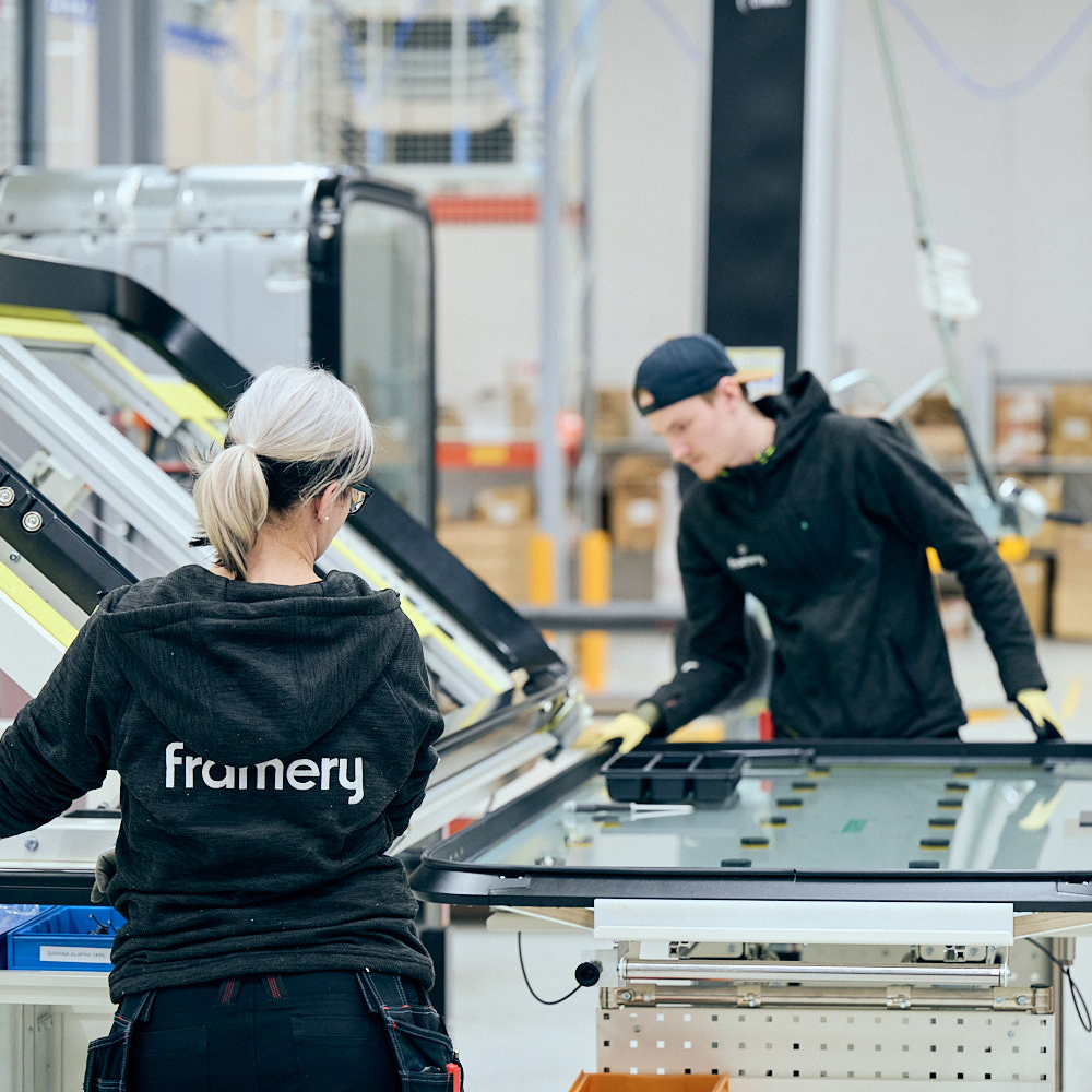 Framery employees working in production line.