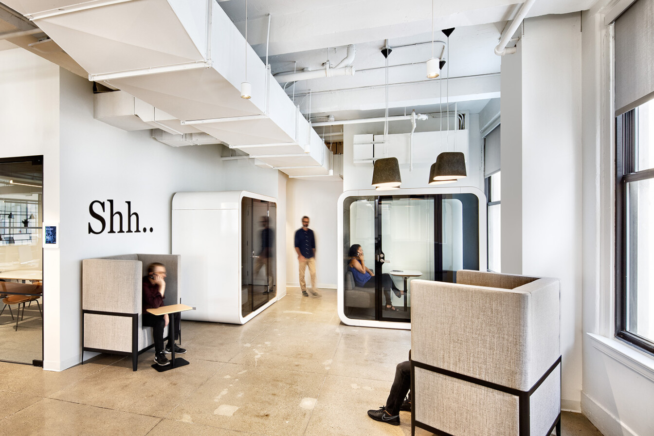 Framery Q pods in an office lobby.