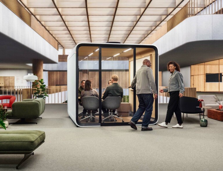 People entering a meeting inside a Framery Six meeting room.