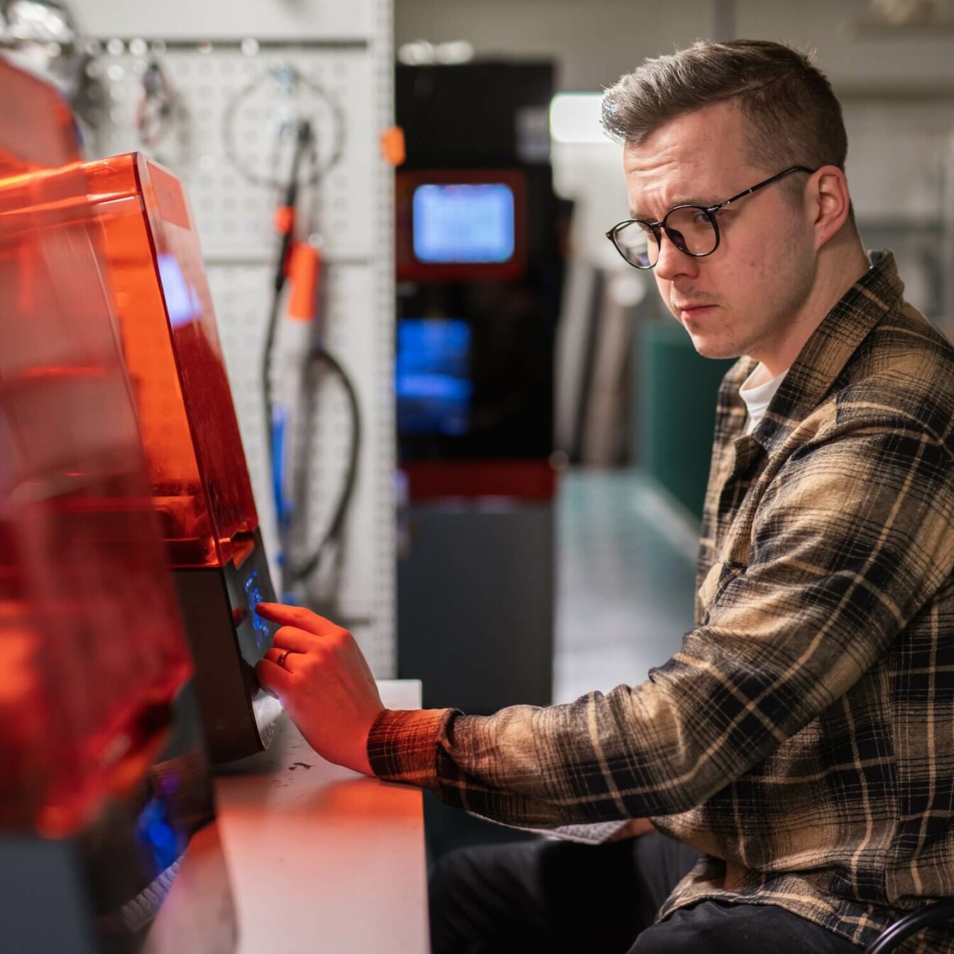 A person working in a technical research lab.