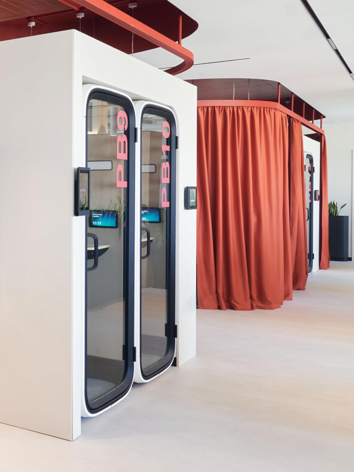 Two Framery One Compact office pods integrated into an office wall.