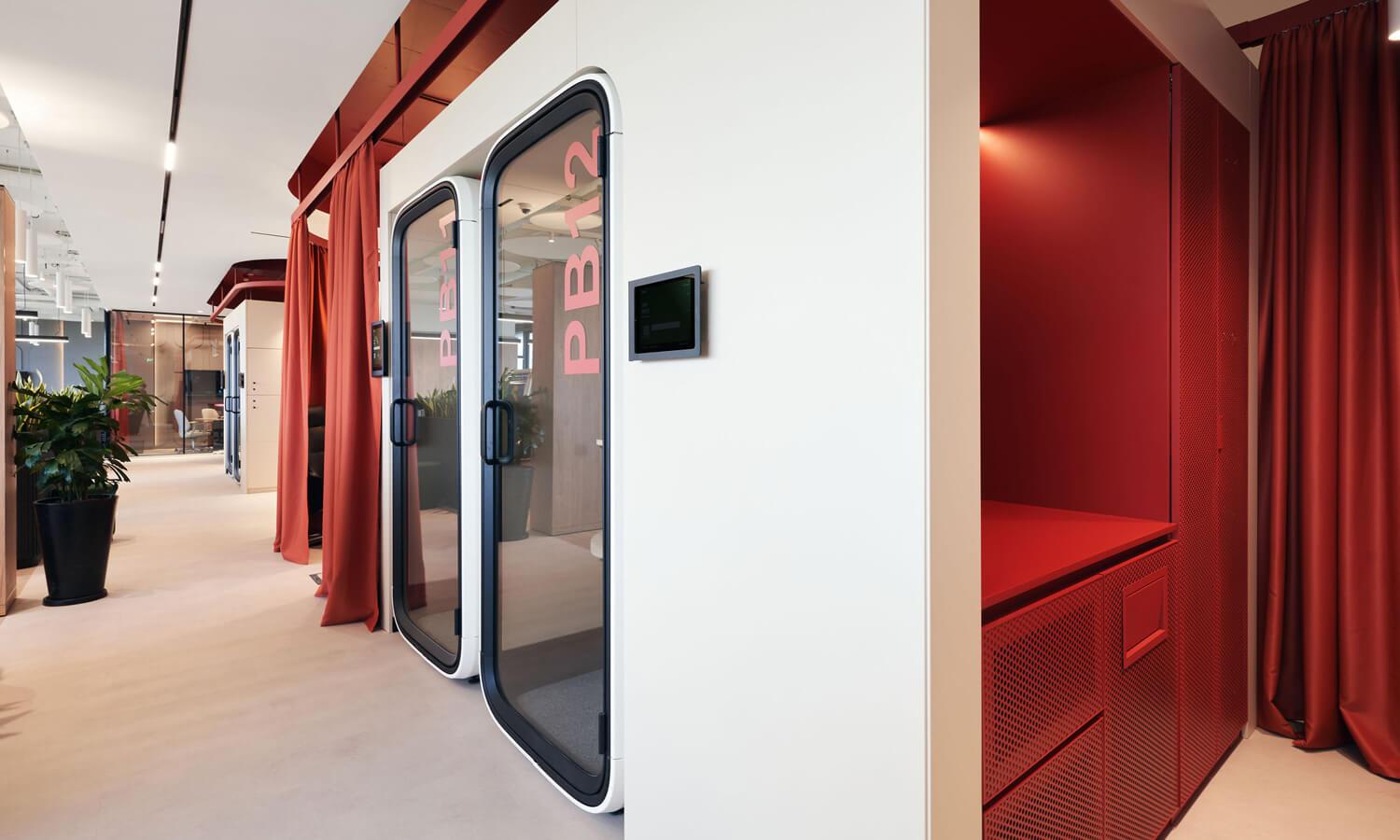 Framery One Compact office pods integrated into an office wall.