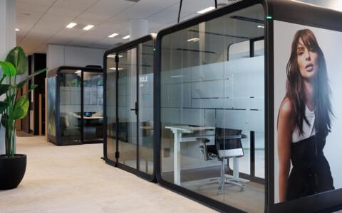 Black framed Framery Four meeting pods at L'Oreal Paris office.