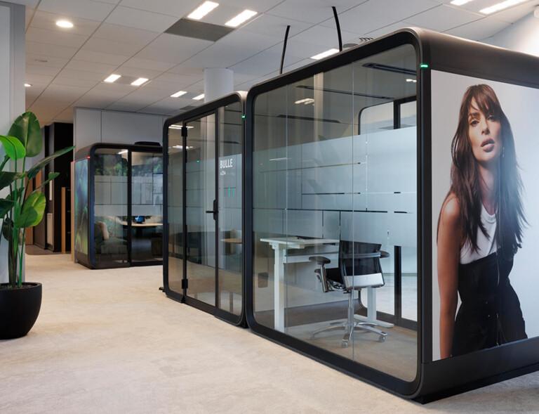 Black framed Framery Four meeting pods at L'Oreal Paris office.