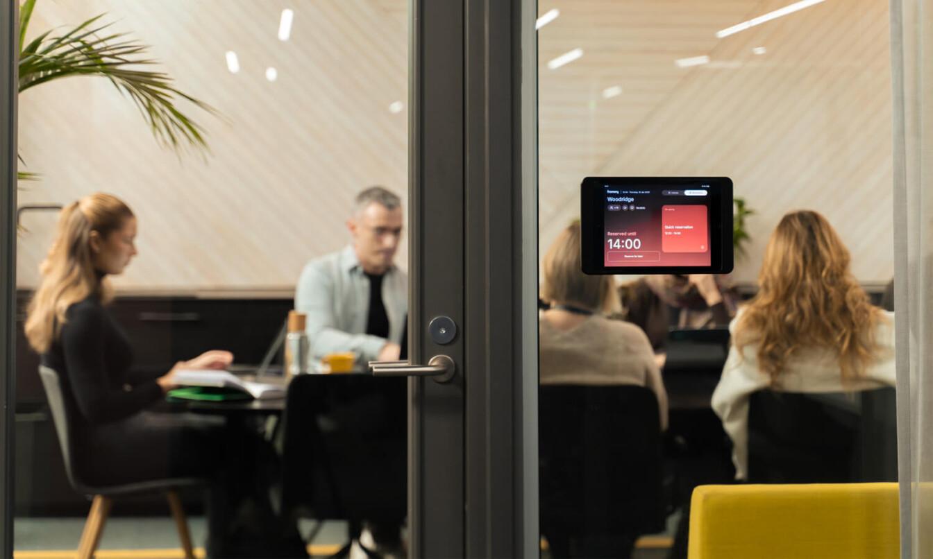 A meeting room with people inside