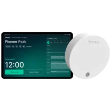 Tablet screen displaying the Framery Room Display with a countdown timer beside a white circular smart device.