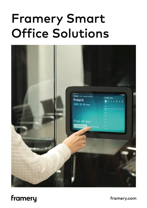 Person taps a wall-mounted touchscreen panel in a Framery Smart Office Solutions setup.