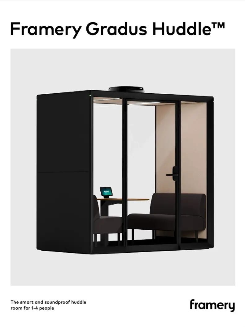 Framery Gradus Huddle glass-walled soundproof meeting pod with seating and a small table inside.