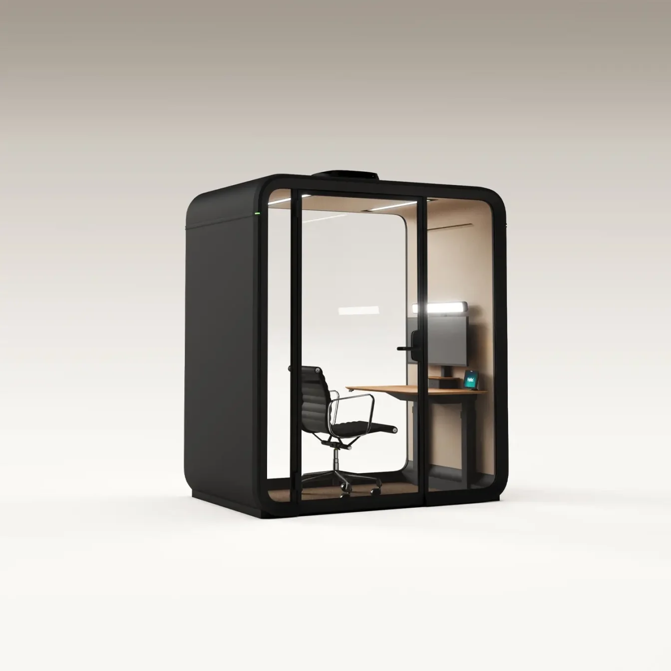 A compact glass-walled Framery One Work workstation pod with a desk, chair, and computer inside.